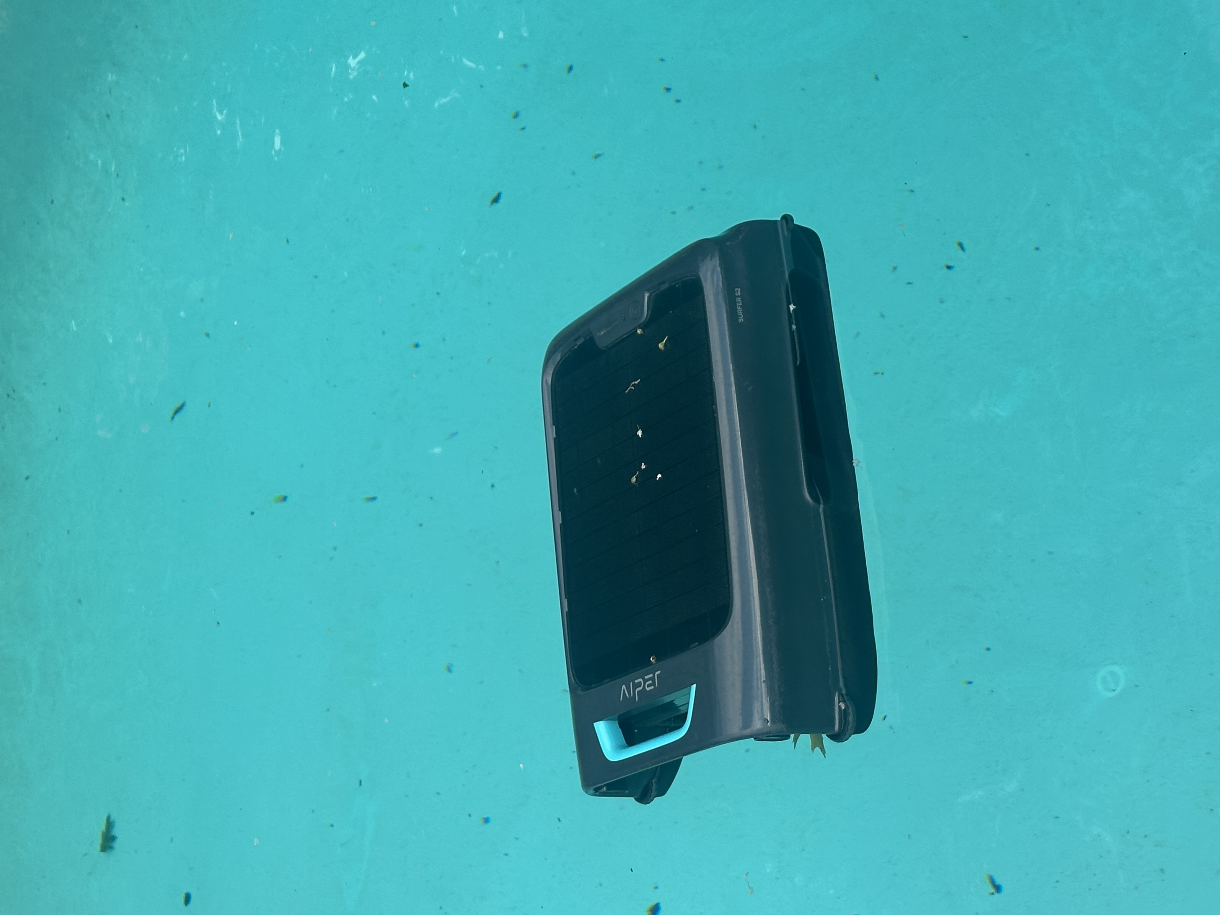 Aiper EcoSurfer S2 skimming the pool surface