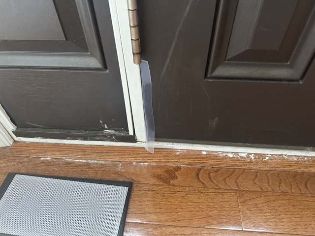 A line of diatomaceous earth powder along a door threshold