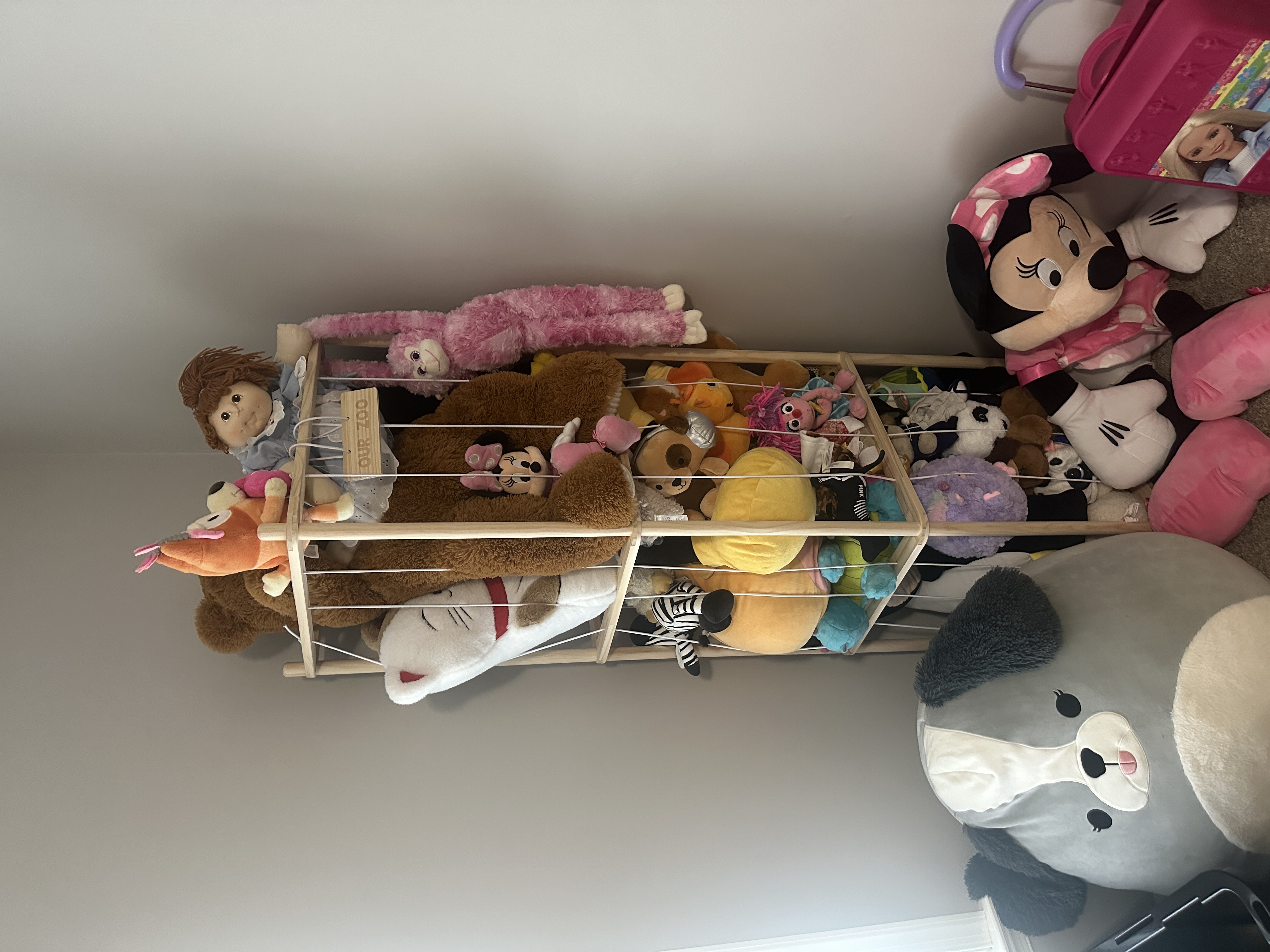 Full view of the stuffed animal storage zoo in the room